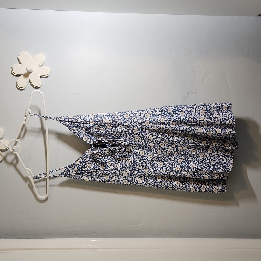 Brand new blue romper with flowers